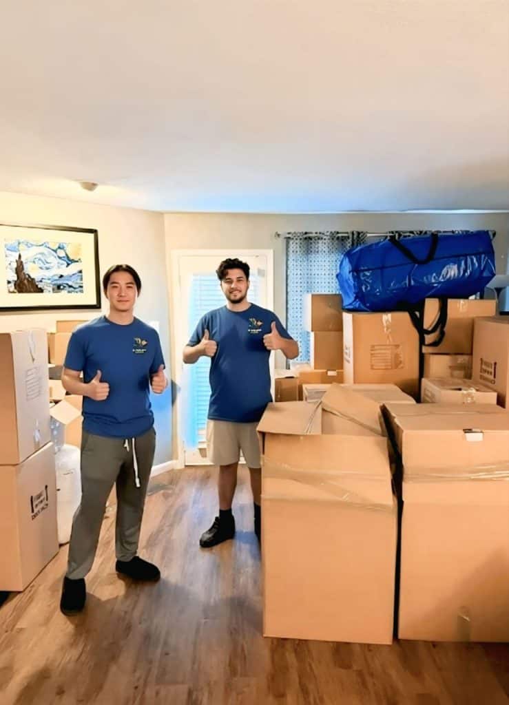 Professional movers packing safely in a residential home for local or long-distance moving.